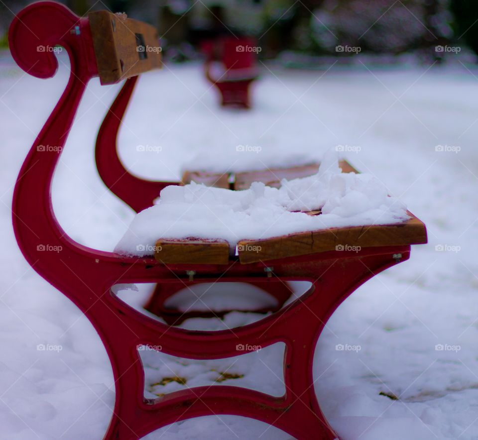 Red bench in snow