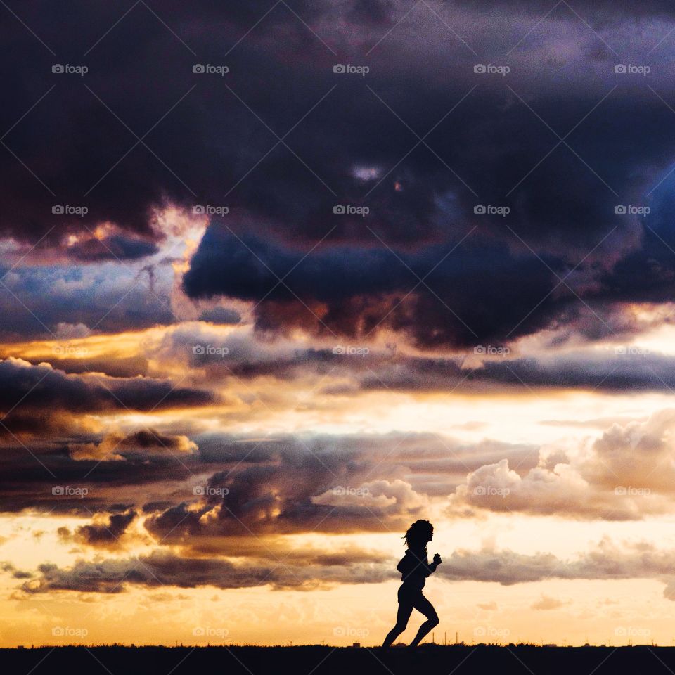 Sunset running. part of an active lifestyle combined with experiencing nature !