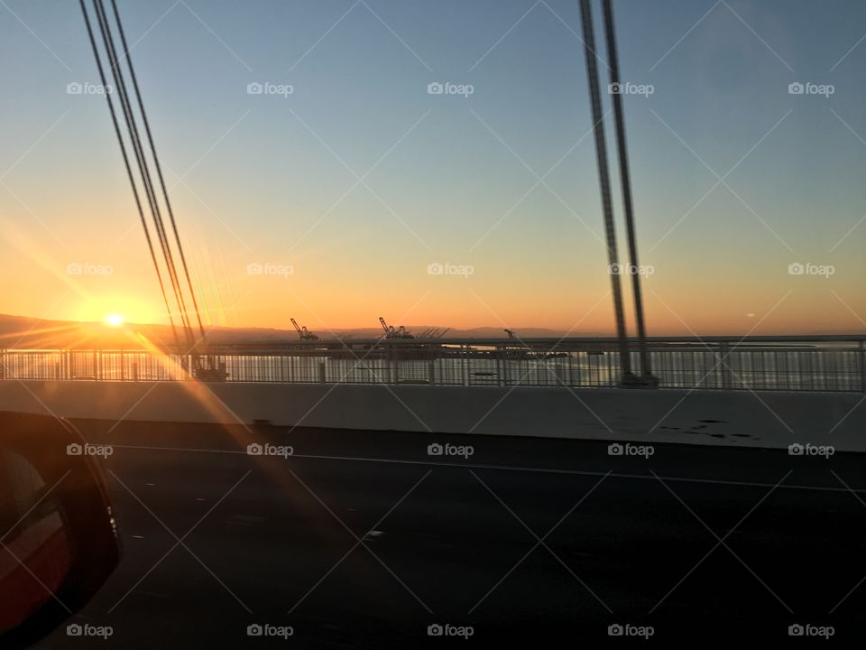 Driving across the Golden Gate Bridge at sunset