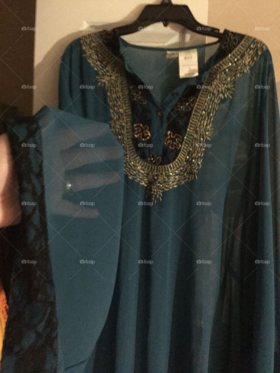 Middle Eastern clothing. This is called "Abaya."
It is a floor length dress that was purchased from East Essence. There is another black dress worn under this. 