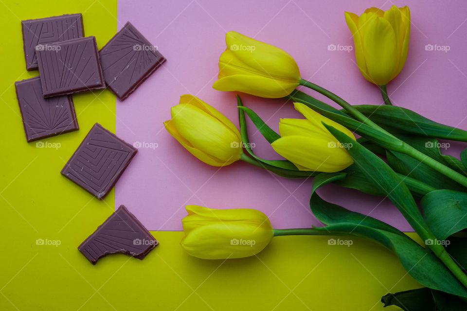 Yellow tulips and pink chocolate