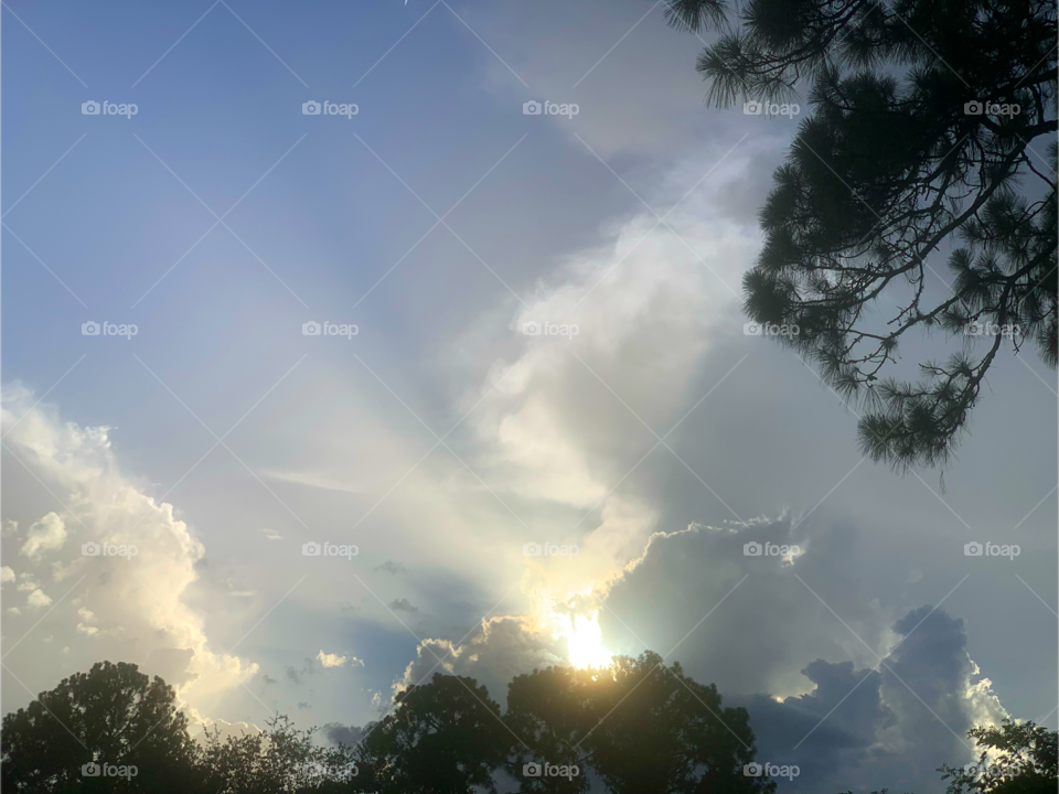 Solar rays in a blue sky.