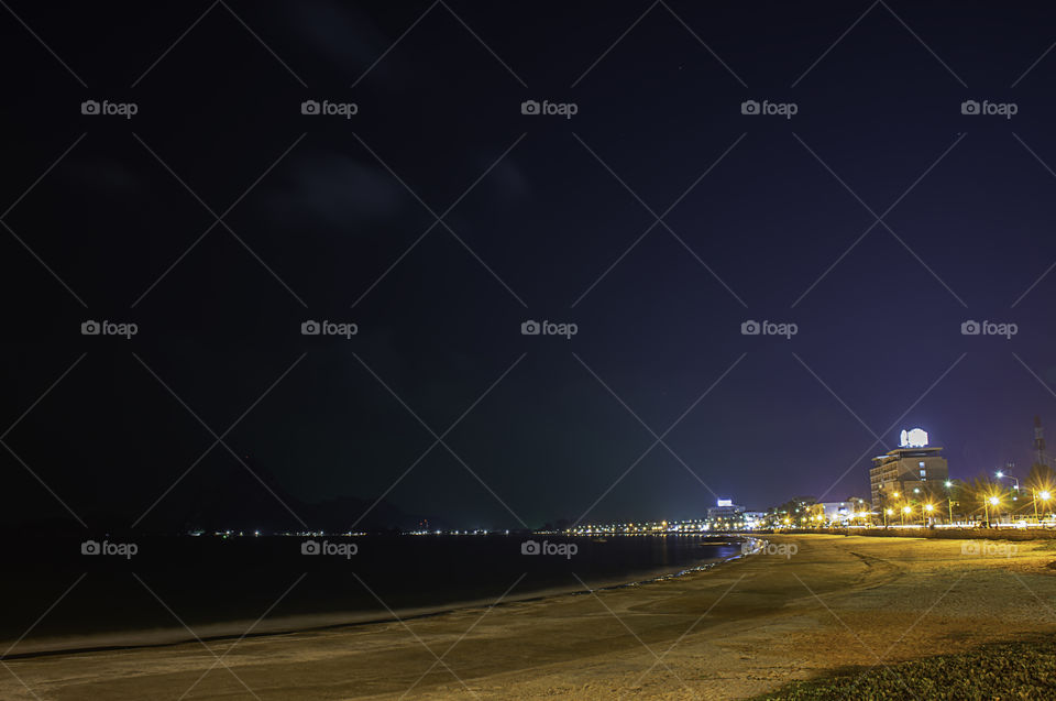 The lights on road at night Background Sea  at Prachuap Bay in Thailand.