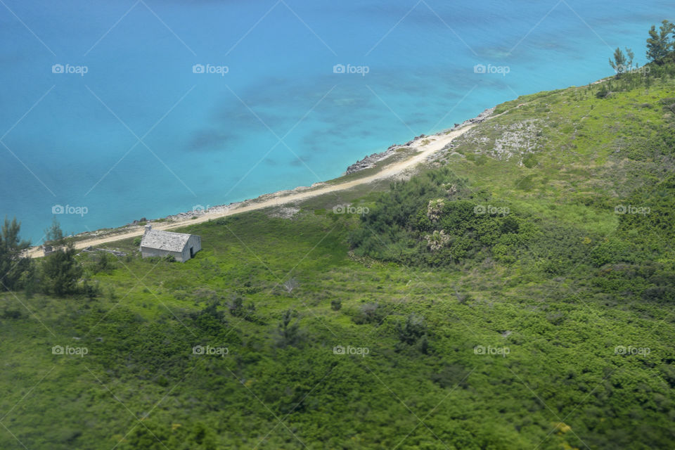 Tropical waters and green coastline