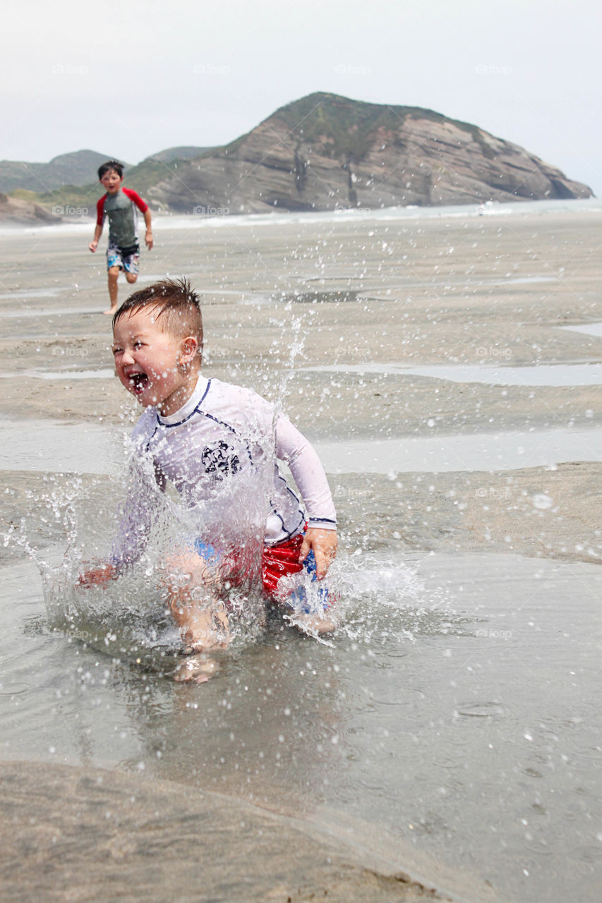 Two children enjoying at beach