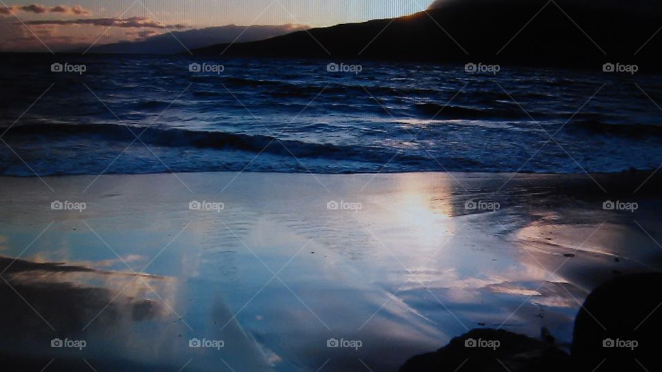Re flexion. On vacation relaxing on the beach in Maui