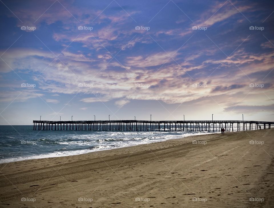 Miles long pier and heavenly skies 