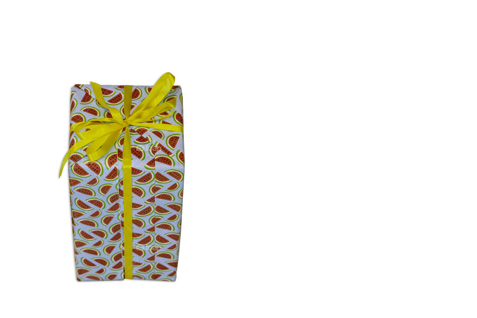 Isolated Gift box wrapped with paper stripe watermelon for the festivities on a white background with clipping path.