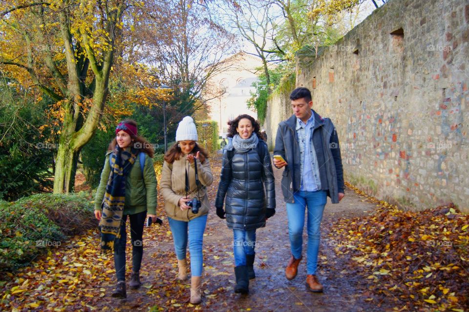 Group of friends walking on road