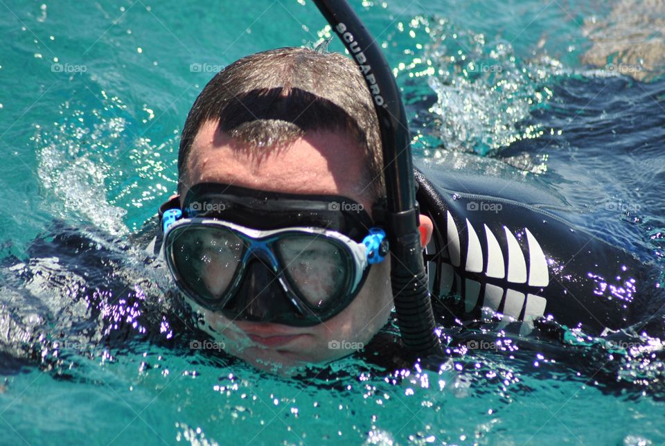 Man snorkeling in sea