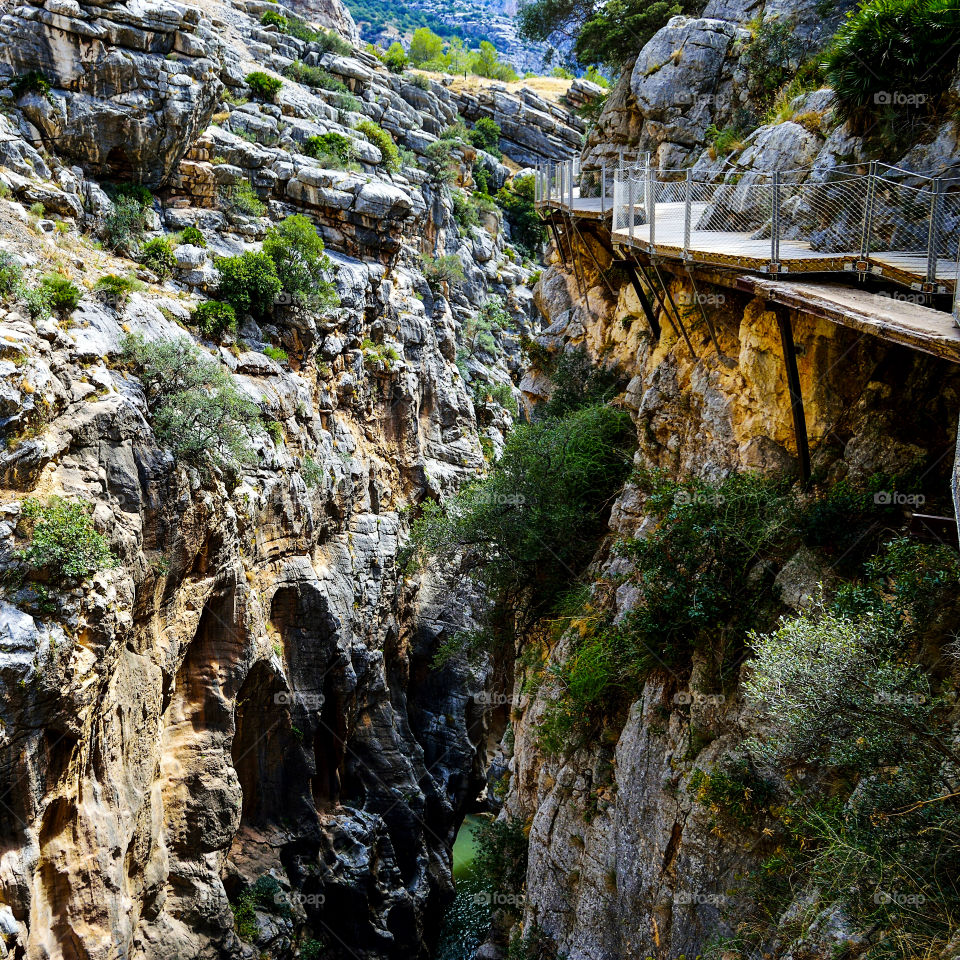 El Caminito del Rey is a passage built on the walls of the Gaitanes gorge, between the municipalities of Ardales, Álora and Antequera, in the province of Málaga, autonomous community of Andalucía, Spain. It is a pedestrian walkway of more than 3 kilometers (in addition to 4.8 kilometers of access), attached to the rock inside a canyon, with sections of a width of just 1 meter, hanging up to 105 meters above the river, in almost vertical walls.