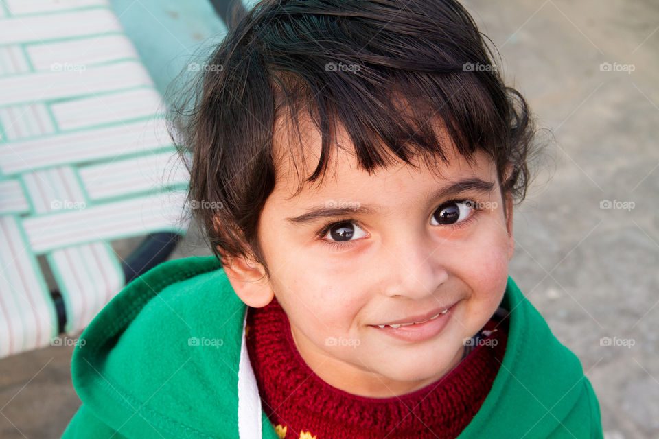 Cute Indian boy with warm clothes during winter