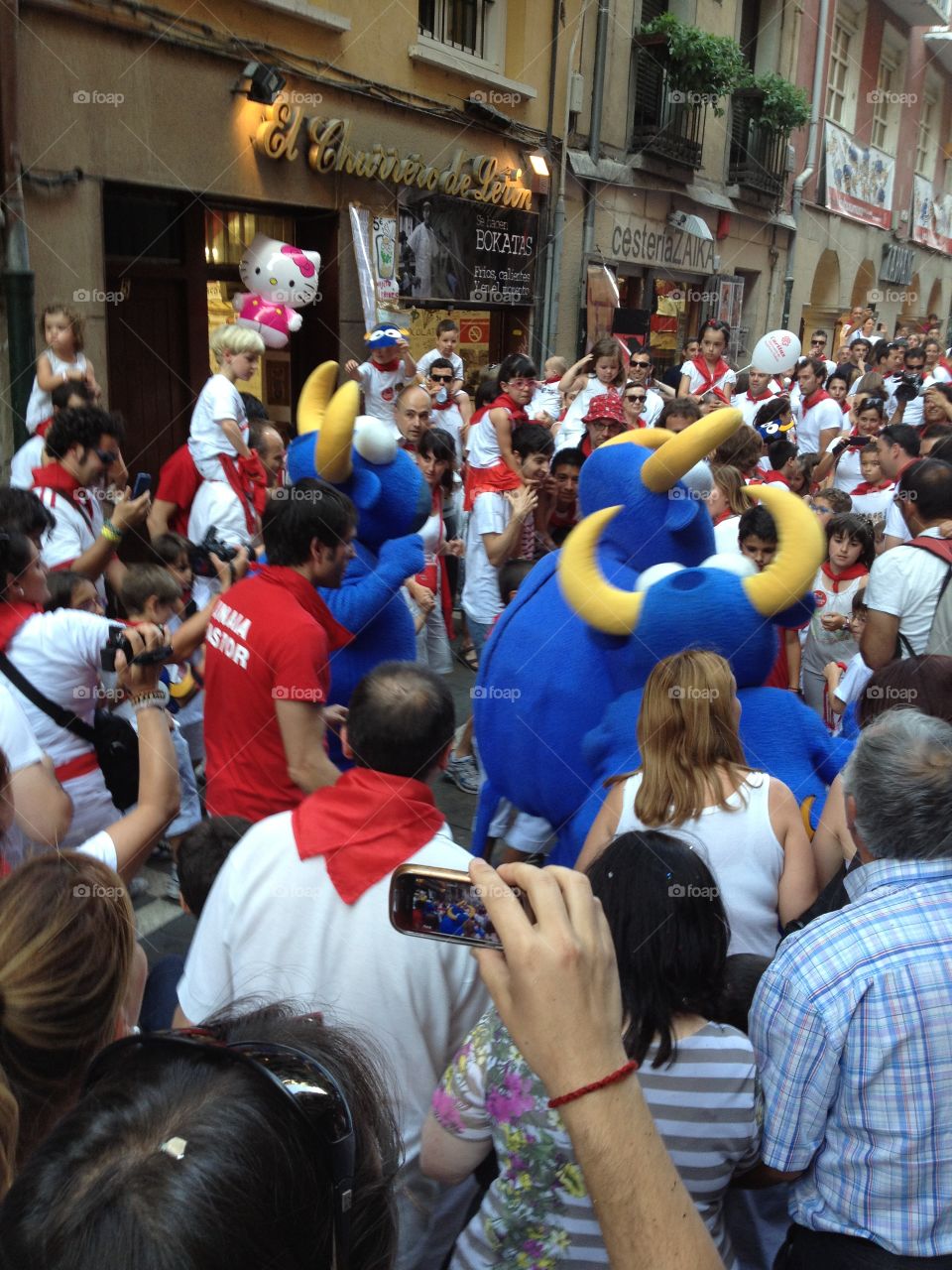 Crowd participating in the children's running with the bulls in Pamplona, Spain