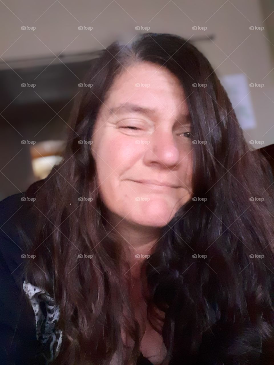 selfie of dark haired lady smiling
