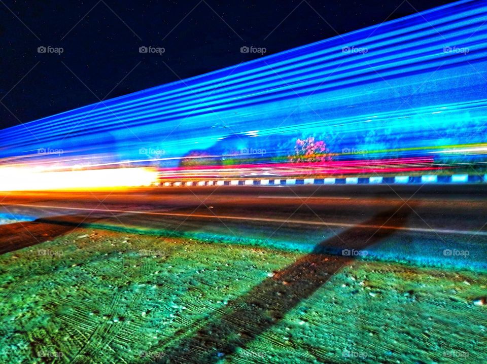 a truck passing through whit lighting exposure