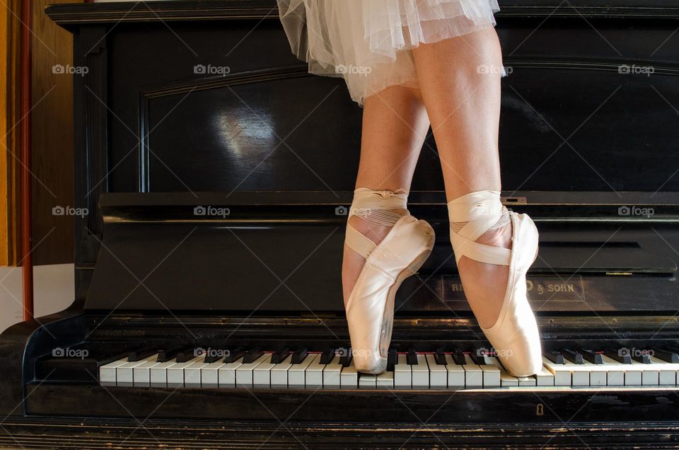 Ballerina Walking on A Piano