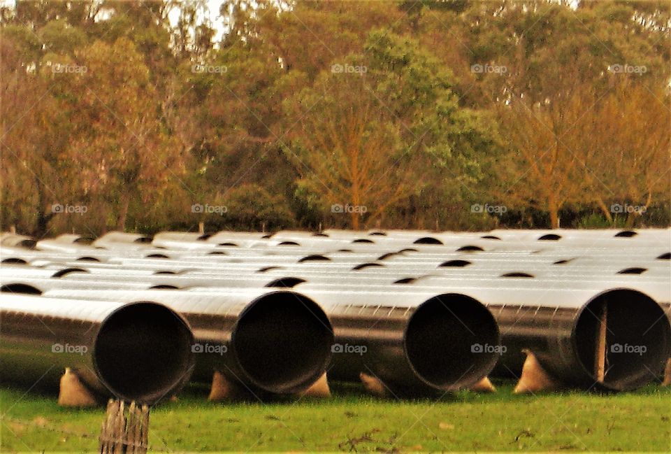 Rows of pipes ready to be laid underground