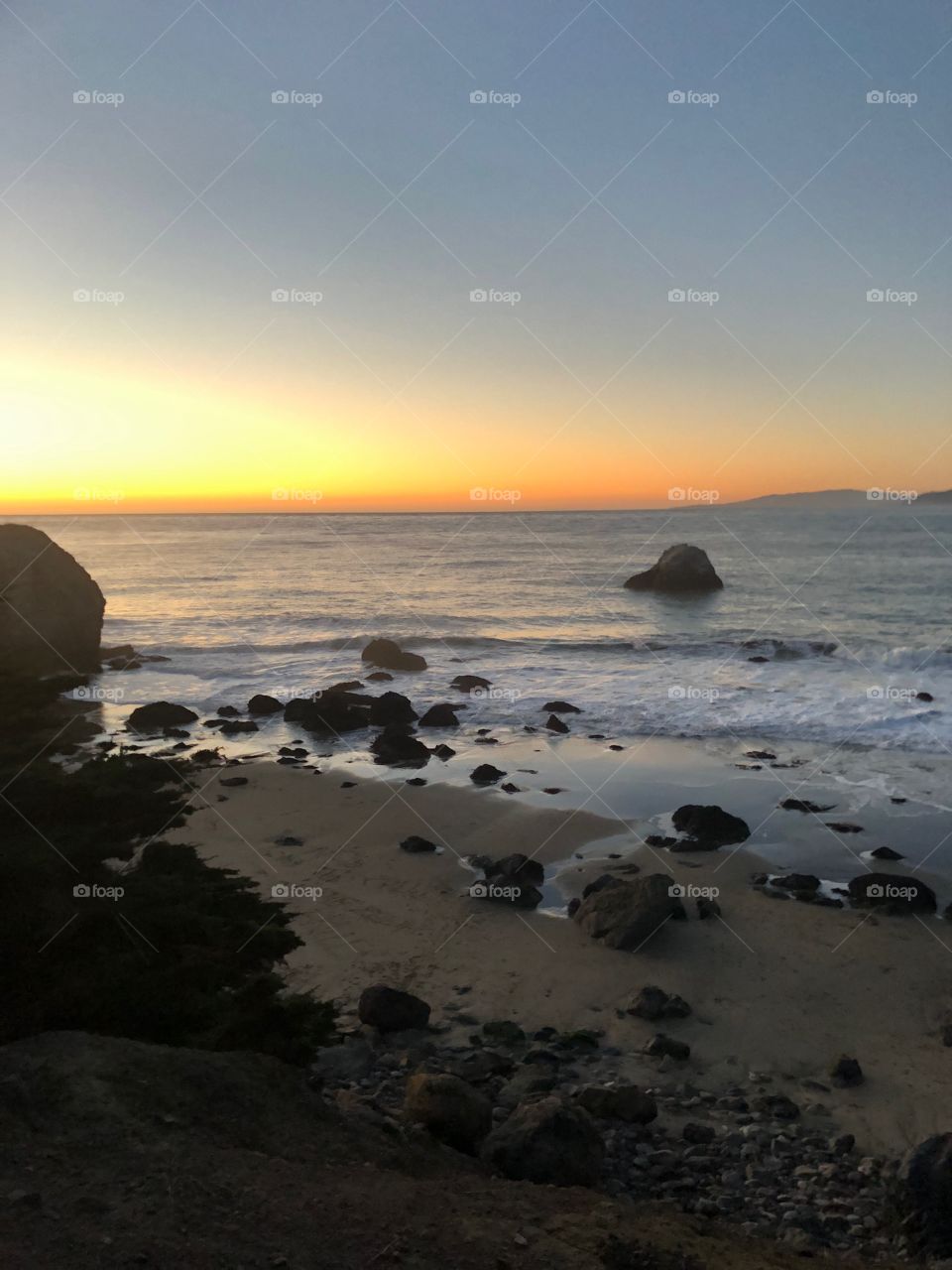 Rocks on the beach sunset 