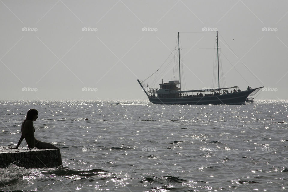 silhouette of a girl on the dock