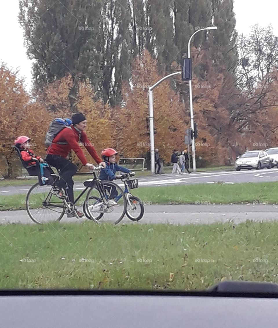 family riding bicycle