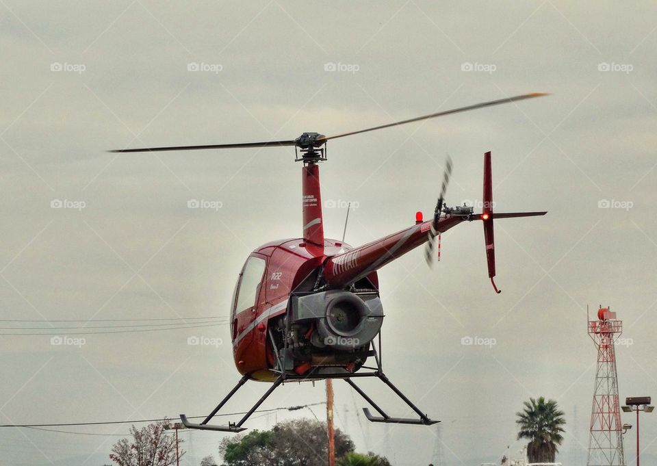 Hovering Helicopter. Robinson R-22 Helicopter Hovering