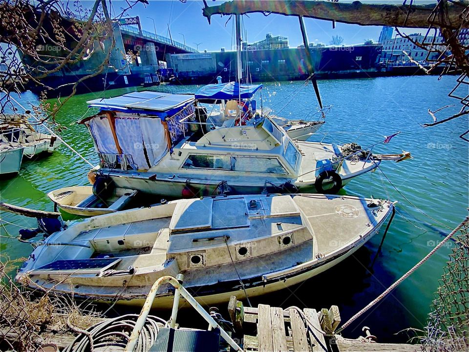 The “Salvation”, our 28 ft 1969 Luhrs cabin cruiser with all the amenities to be a functional houseboat at Newtown Creek in LIC, Queens, NY on a bright sunny afternoon in March, 2022. Hypnotic Productions