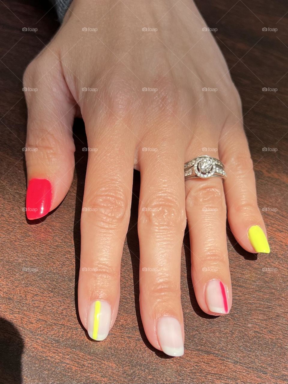 A fun bright neon gel nail art manicure 