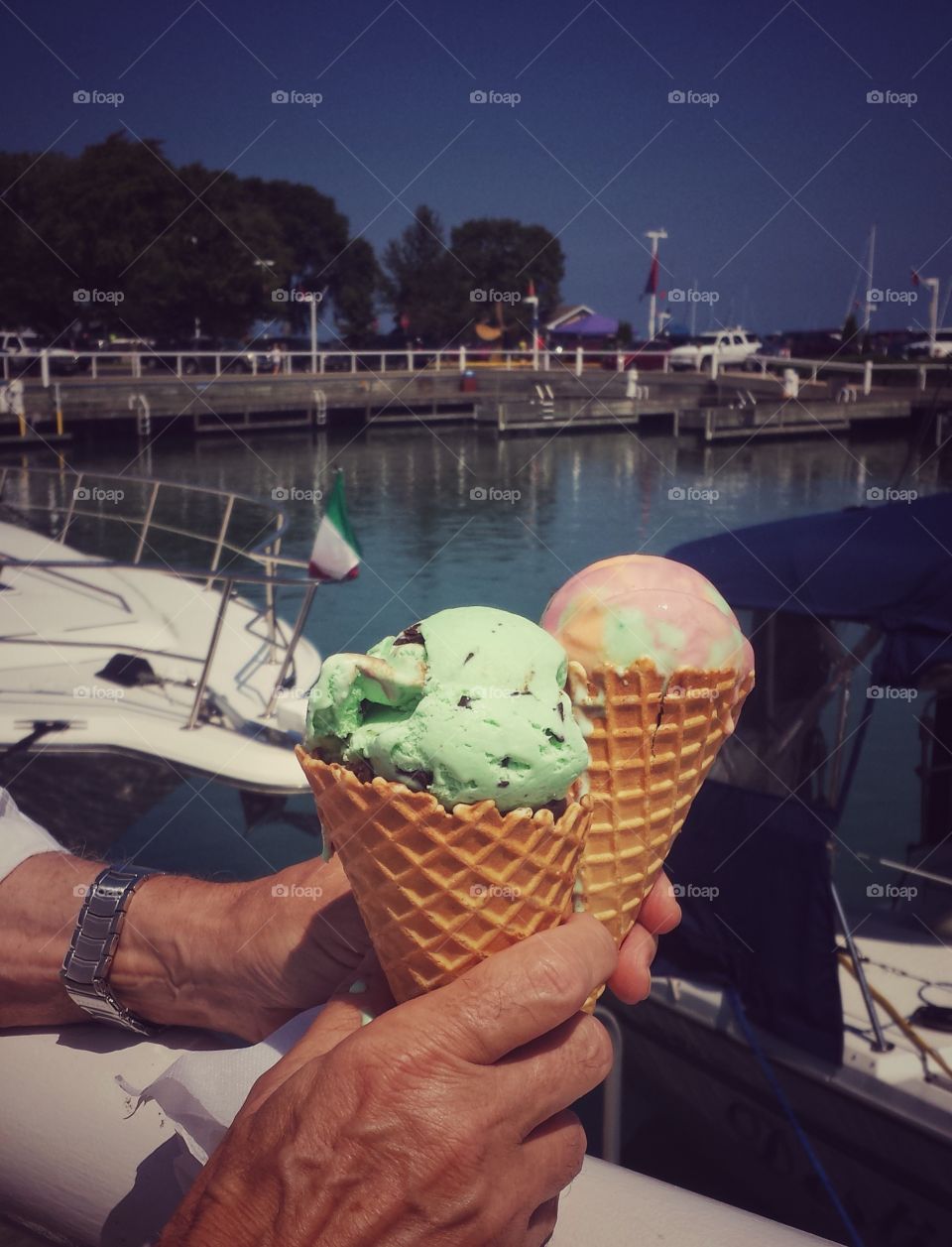 Hands Holding Ice Cream. Harborside