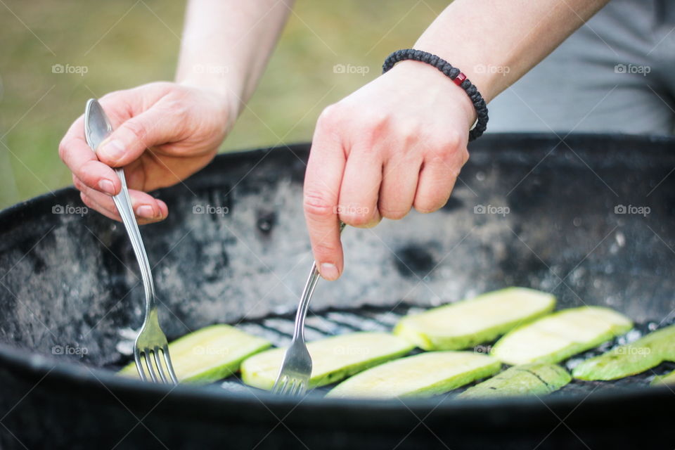 A person preparing vegetable