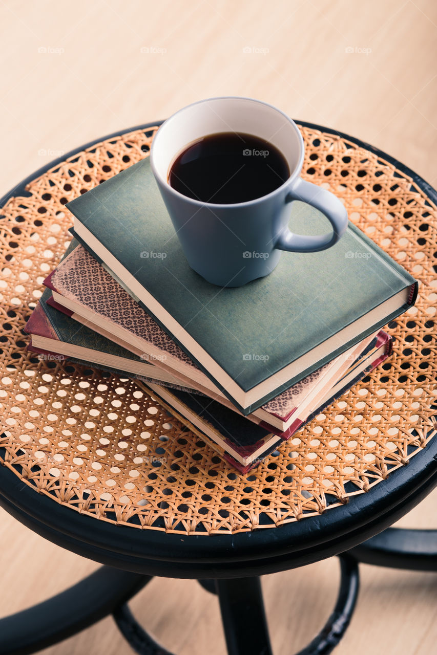 A few books with cup of coffee and cookies on wooden floor. Time for relax. Spending leisure time on reading. Cozy and comfortable. Learning from books 📖Studying for the next exam 😌