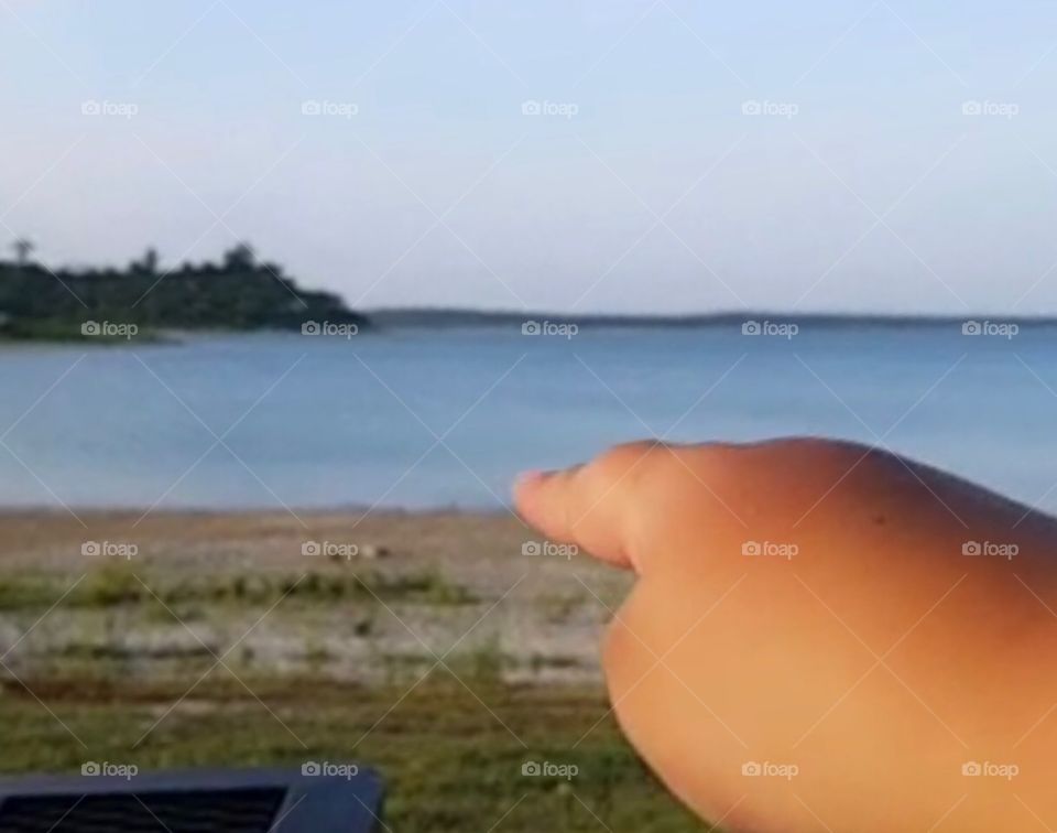 Finger pointing to horizon