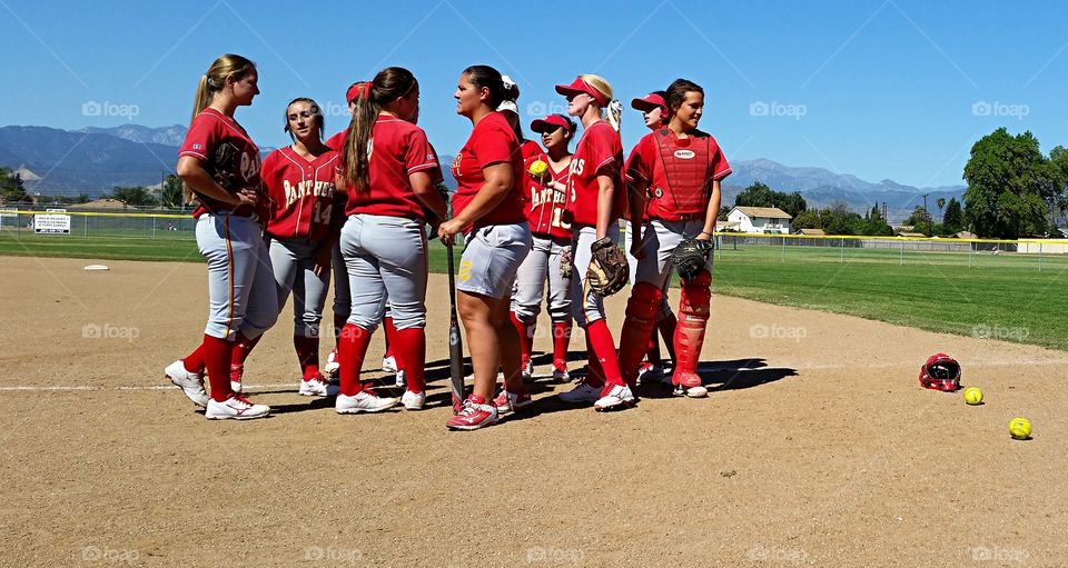 High school softball. A little pep talk before the game