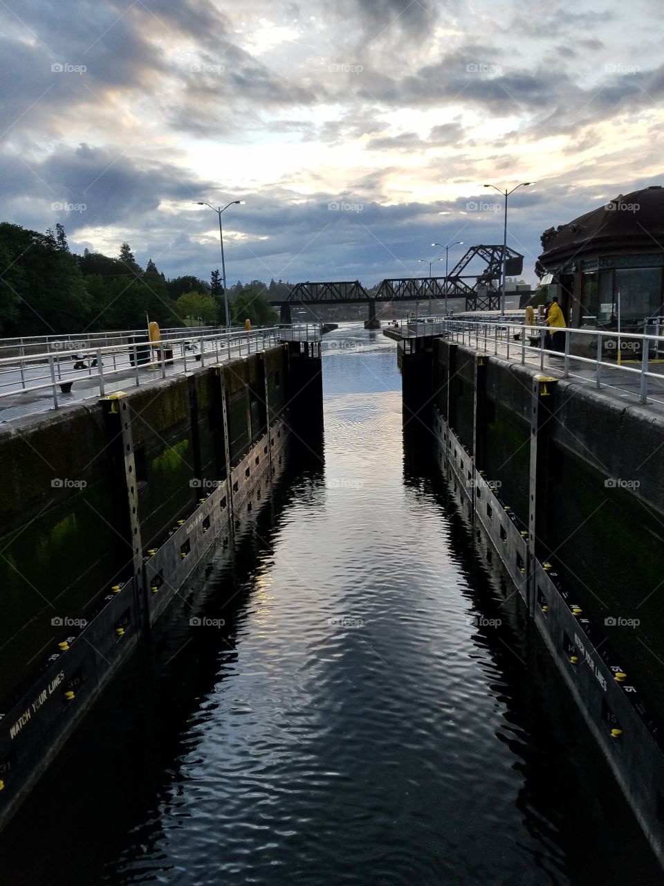 small chamber with gates on salt water side in motion. Hiram M Chittenden Locks. Seattle, Washington 5/19/2016