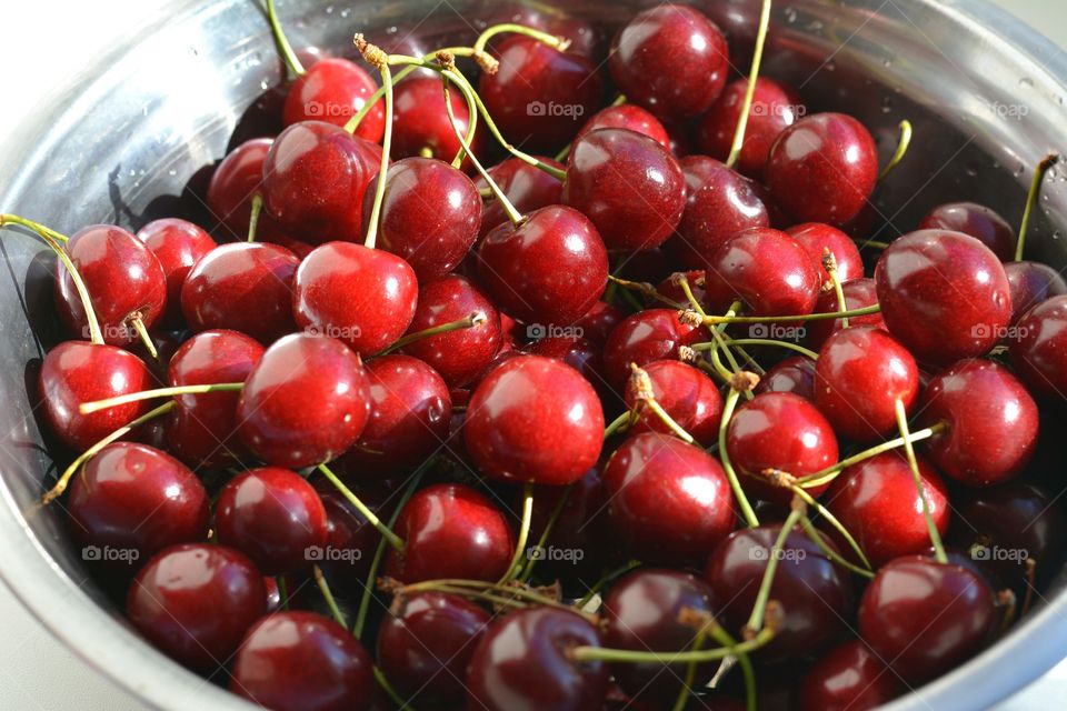 red cherry summer food on a plate natural background