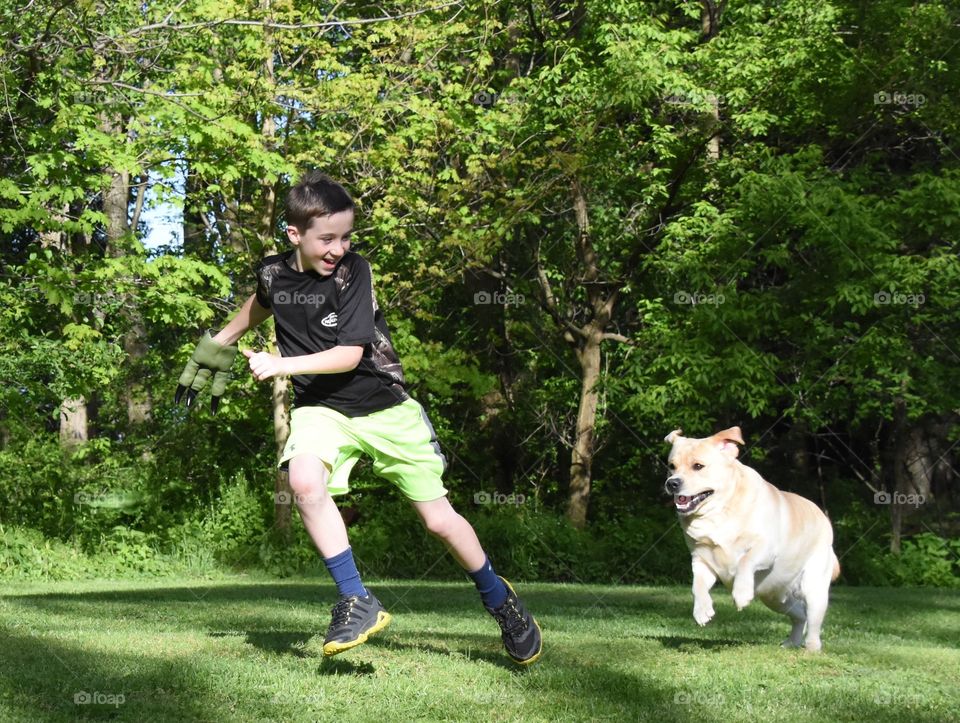 A spring walk with your dog, a young boy and his yellow lab having fun