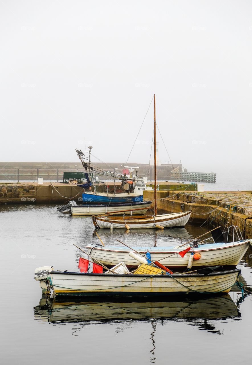 Sailboats near jetty