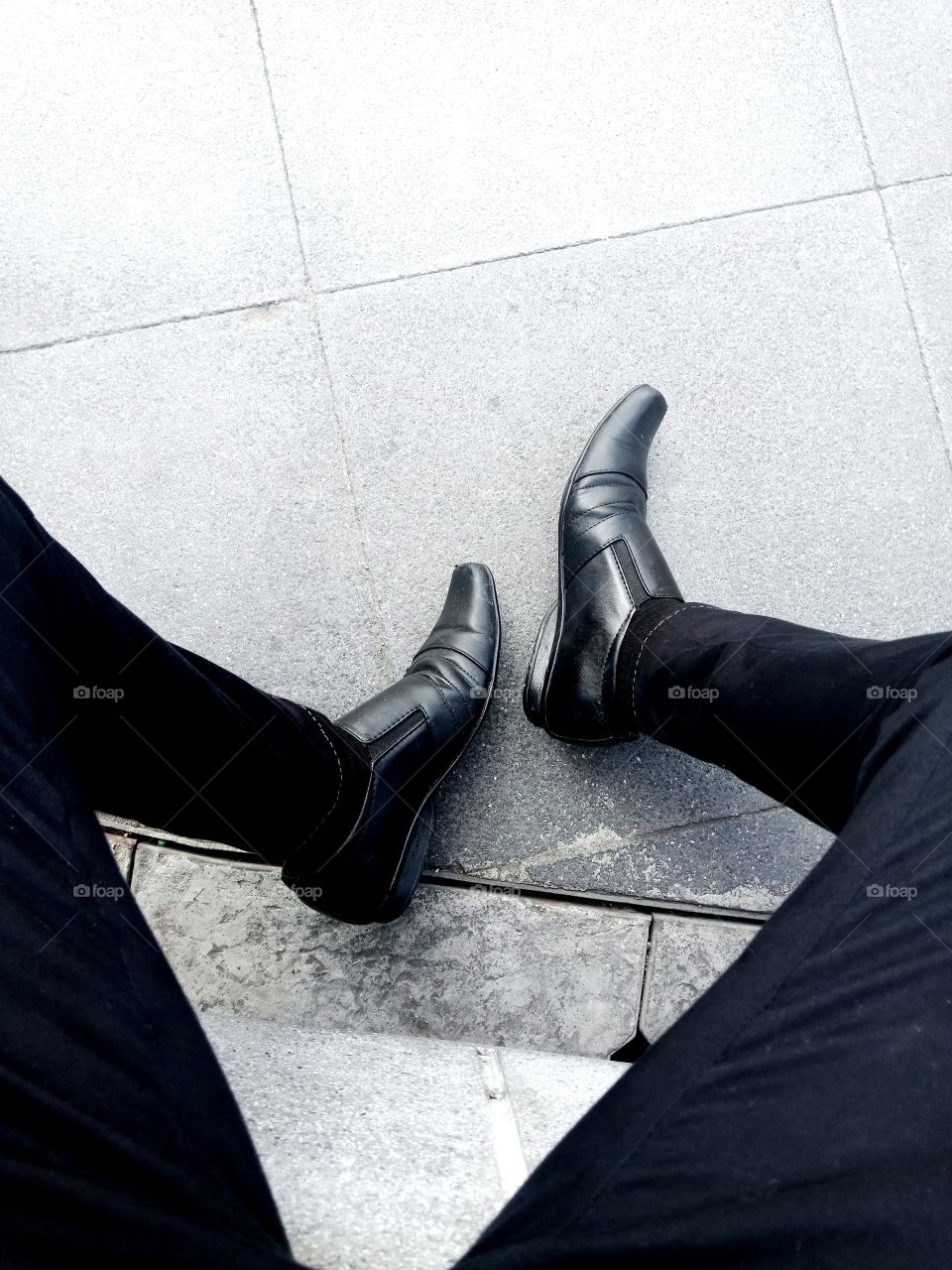 shoes legs floor black sit-down
