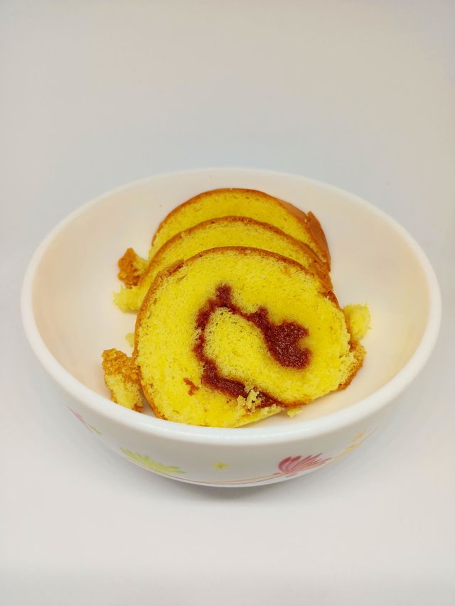 Yellow jam roll cakes isolated set on 
white background