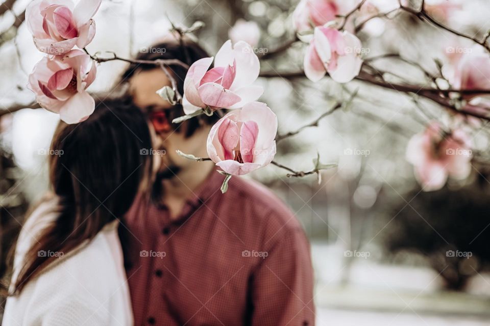 couple in magnolia garden