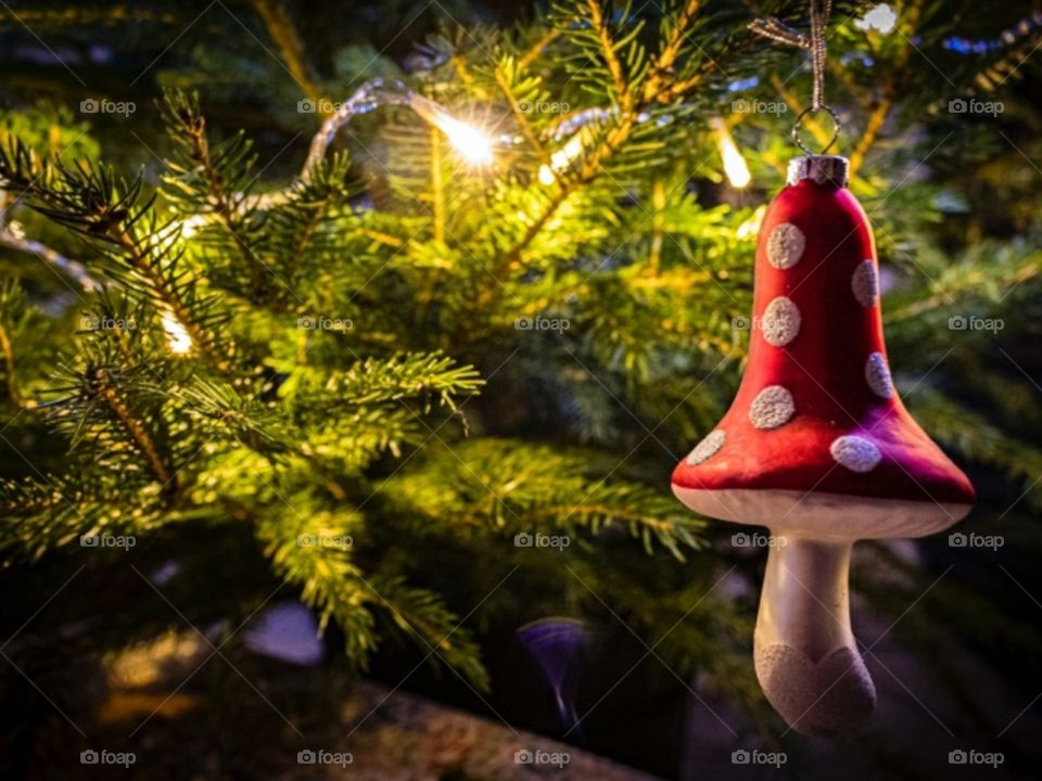 Christmas toy fly agaric on the tree