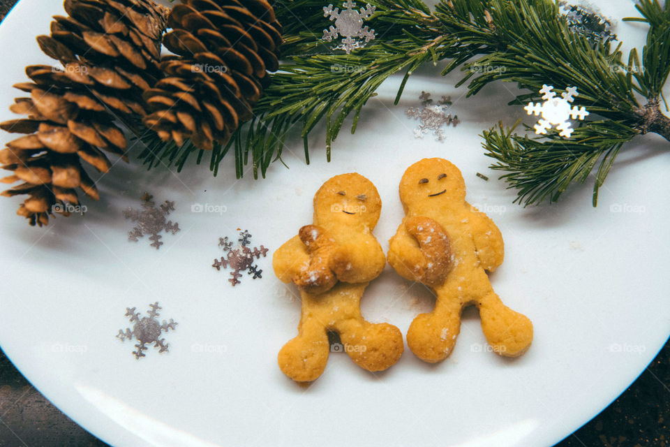 Christmas cookies with Spruce branch on a plate