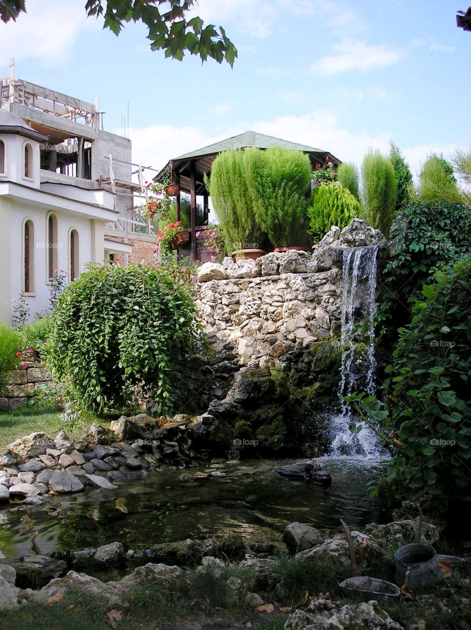 Courtyard with waterfall and flowers 