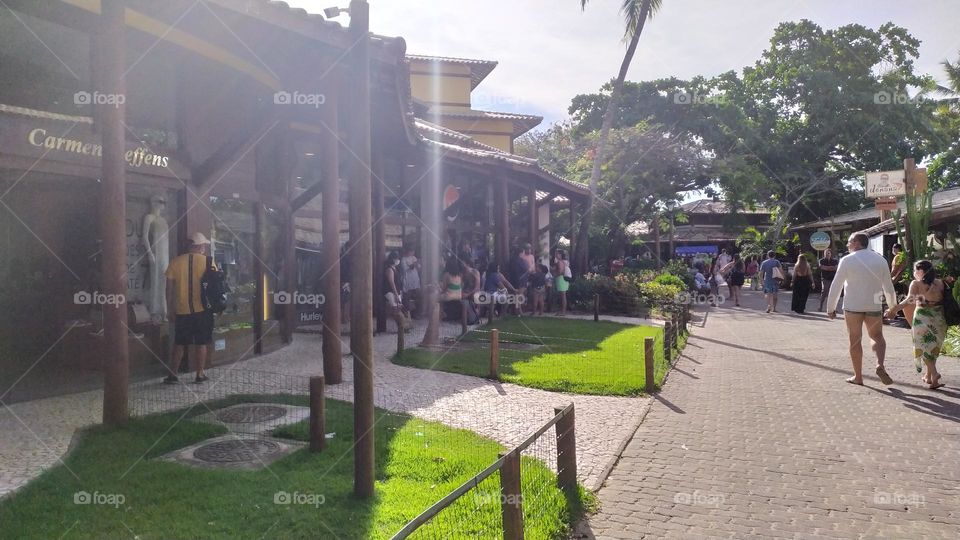 people roasting in the tropical village of Praia do Forte Bahia Brazil