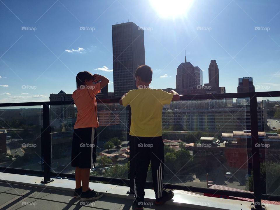Downtown OKC, deck of Loft, two friends enjoying the view
