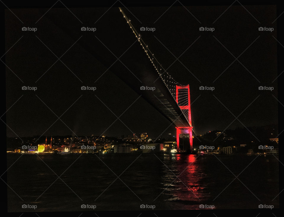 Red bridge through Bosphorus at Istanbul
