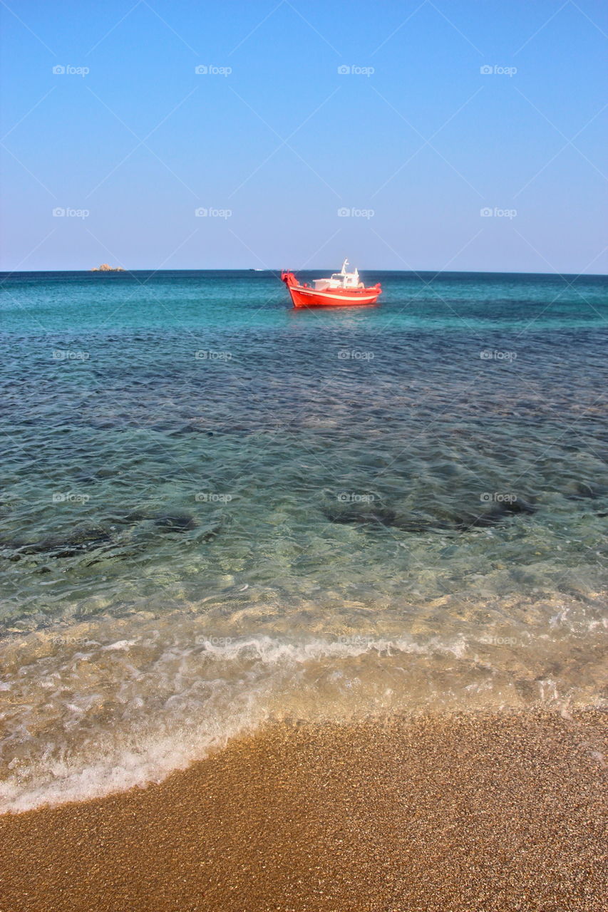 Distant view of boat in sea