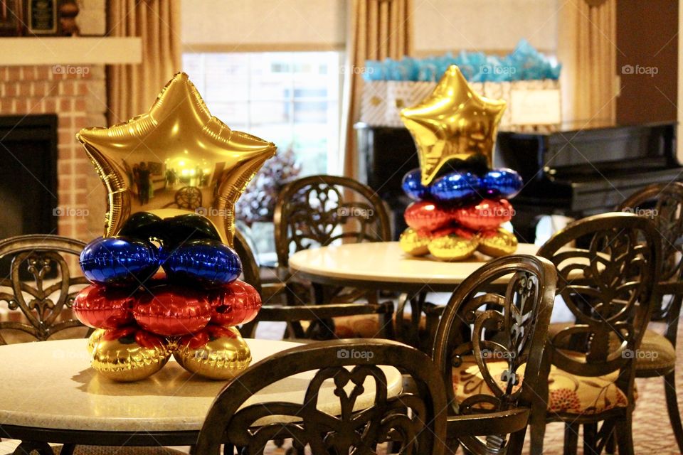 Tables with Gold Star Balloons