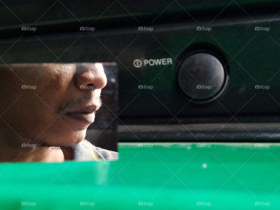 mirror reflection of man with thin mustache