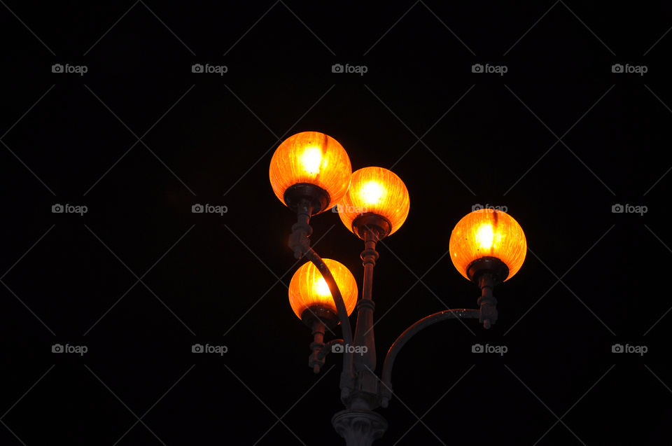 orange lanterns in the darkness on the street