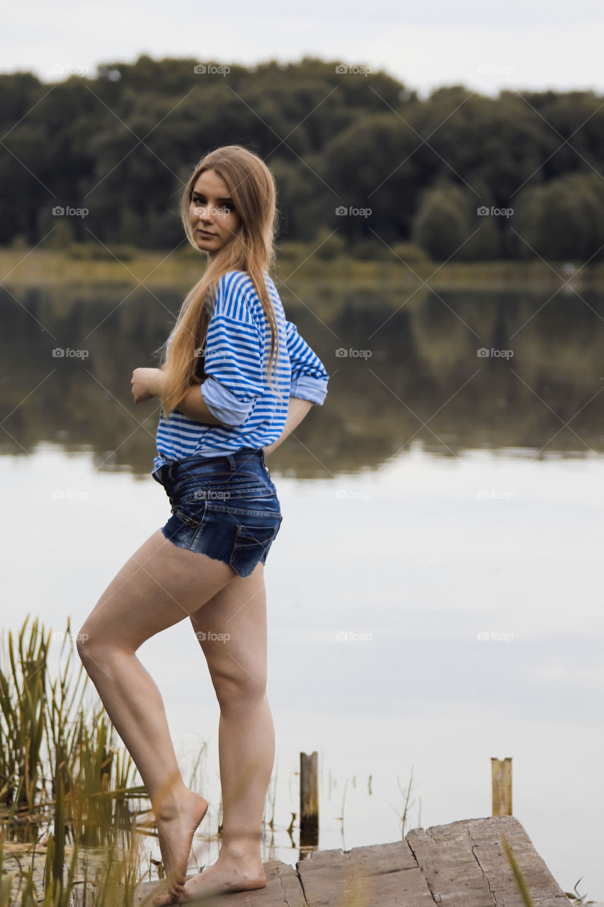 A girl with blond hair on the lake in a striped shirt and short denim shorts on the background of grass, reeds and an old wooden boat
Girl, woman, man, blonde, blonde hair, striped shirt, short shorts, denim shorts, shore, lake, grass, reeds, old boat, feelings, emotions, tenderness, love, lifestyle, lifestyle, vacation